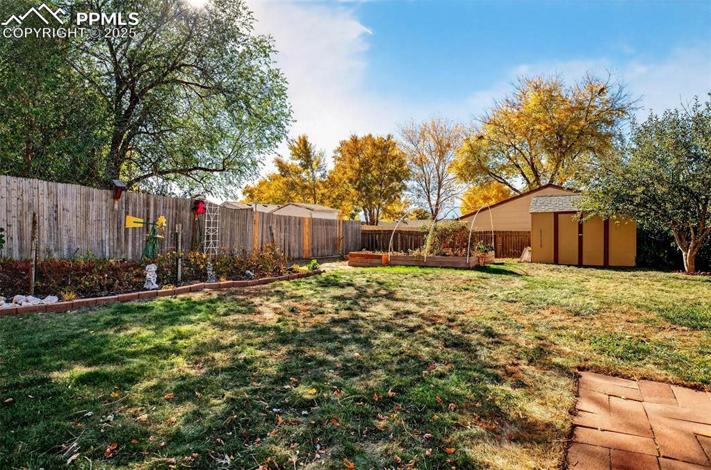 Image 31 of 36: Fully fenced back yard offers privacy from neighbors while still offering s