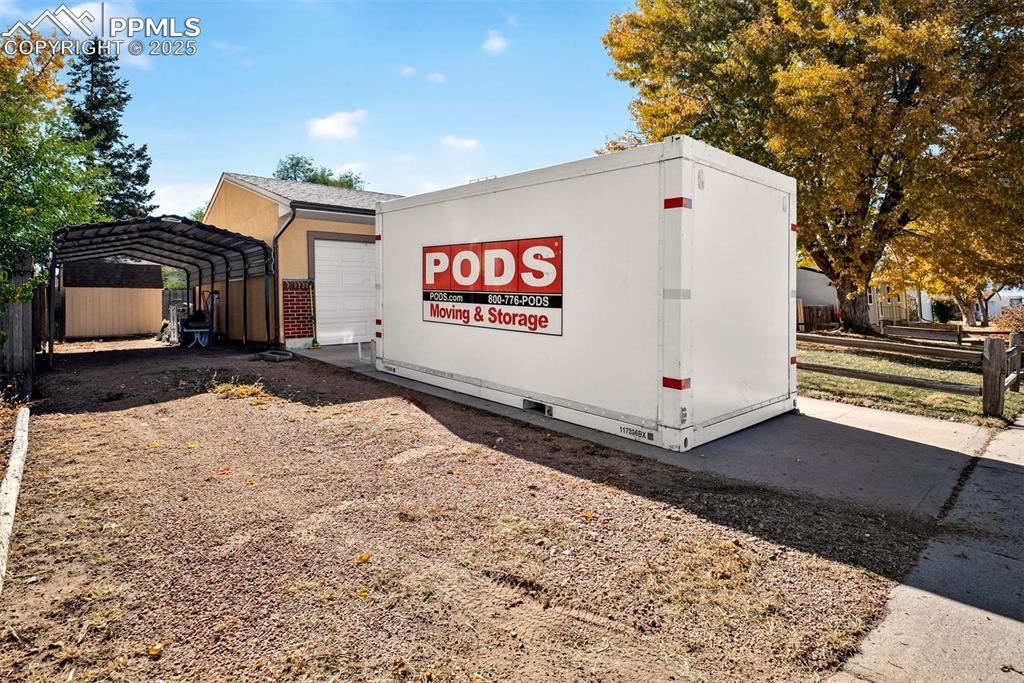 Image 34 of 36: On top of the attached single car garage, protect any other vehicles with t