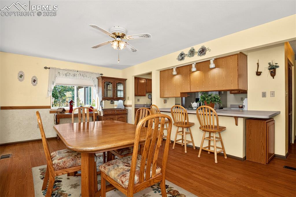 Image 6 of 36: Natural wood flooring throughout the main living areas