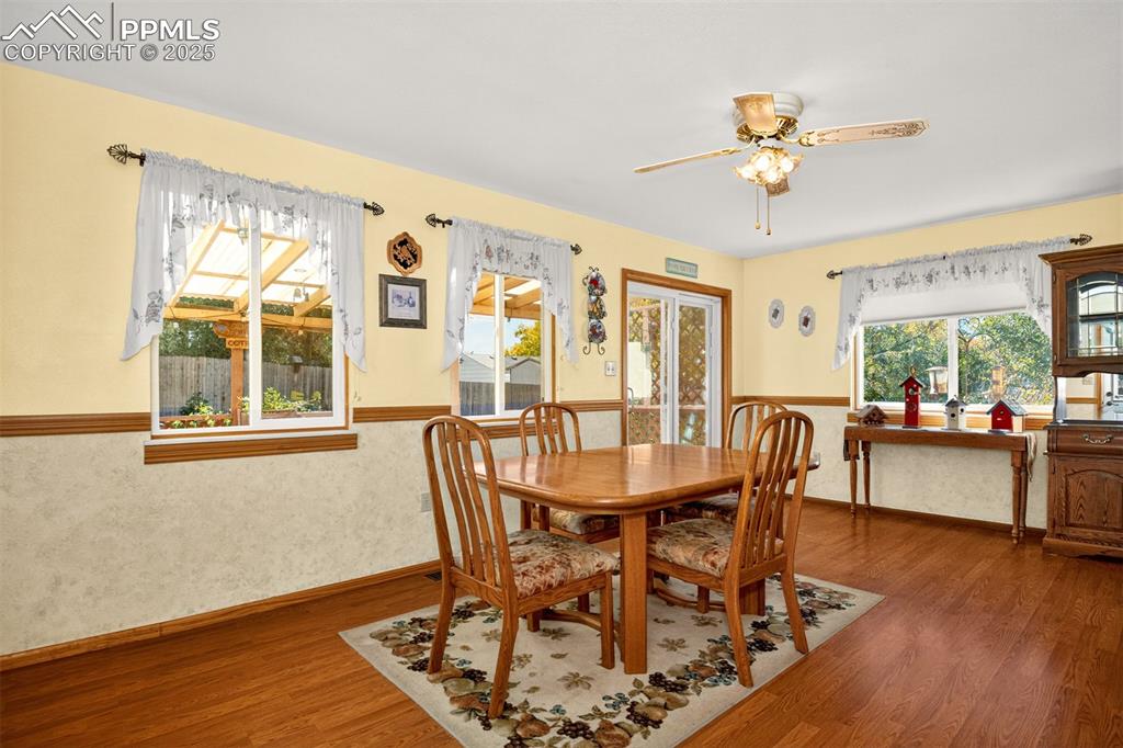 Image 7 of 36: Many windows surround the room to fill it with light and offer views of the