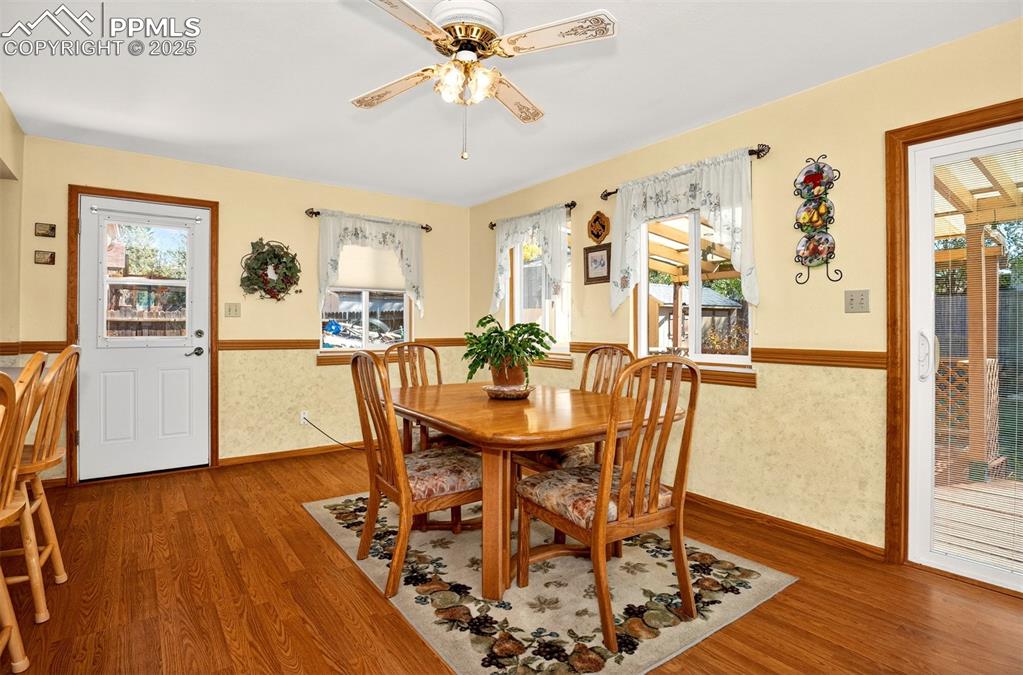 Image 8 of 36: Dual walk out access points, one leads to the covered wood deck and the oth