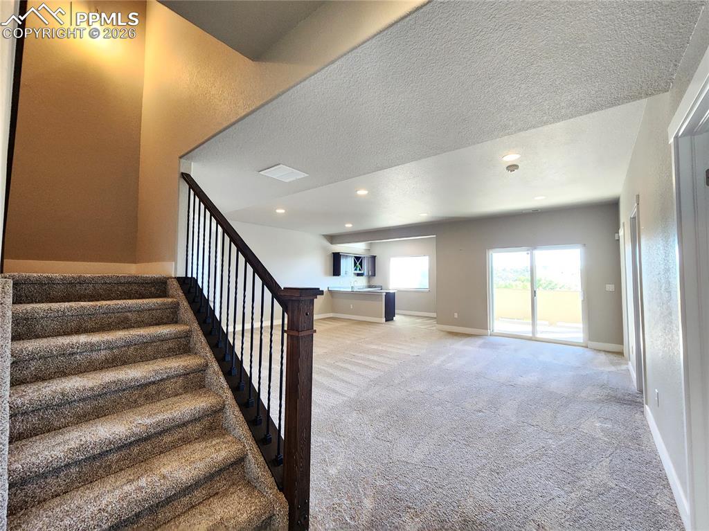 Image 27 of 50: Lower Staircase to Walkout Basement
