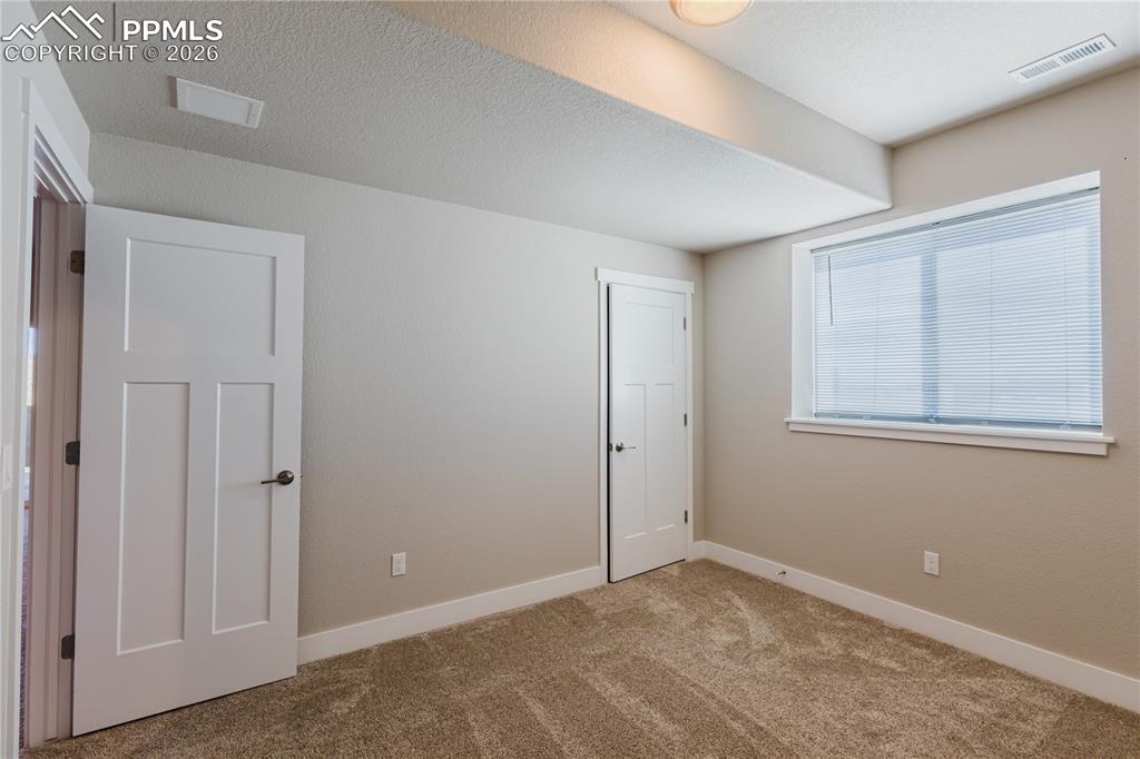 Image 33 of 50: Basement Bedroom
