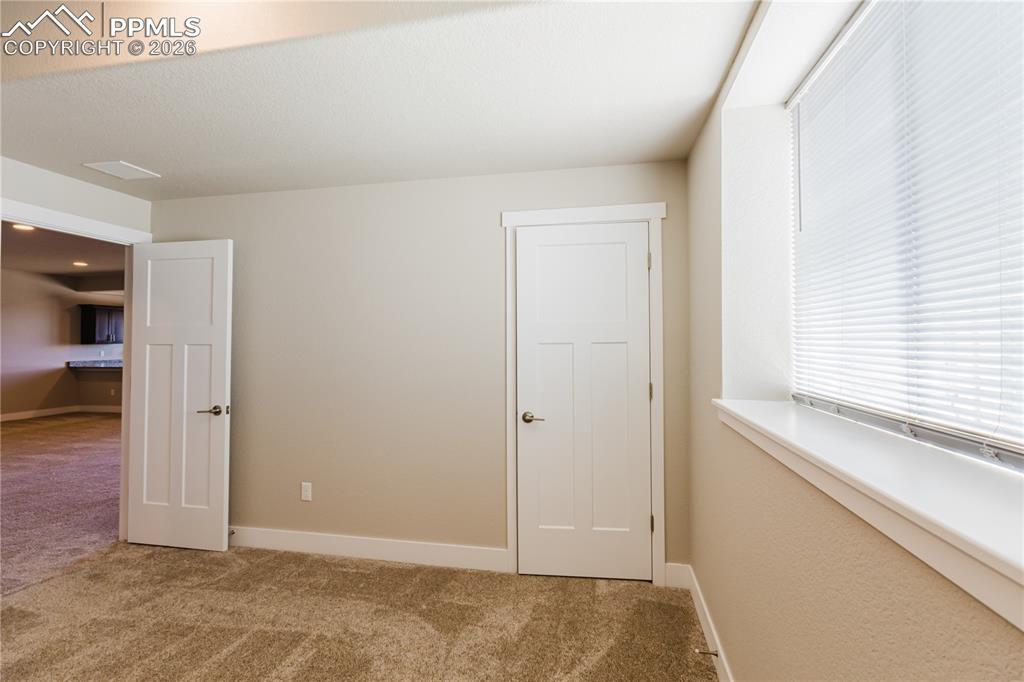 Image 34 of 50: Basement Bedroom