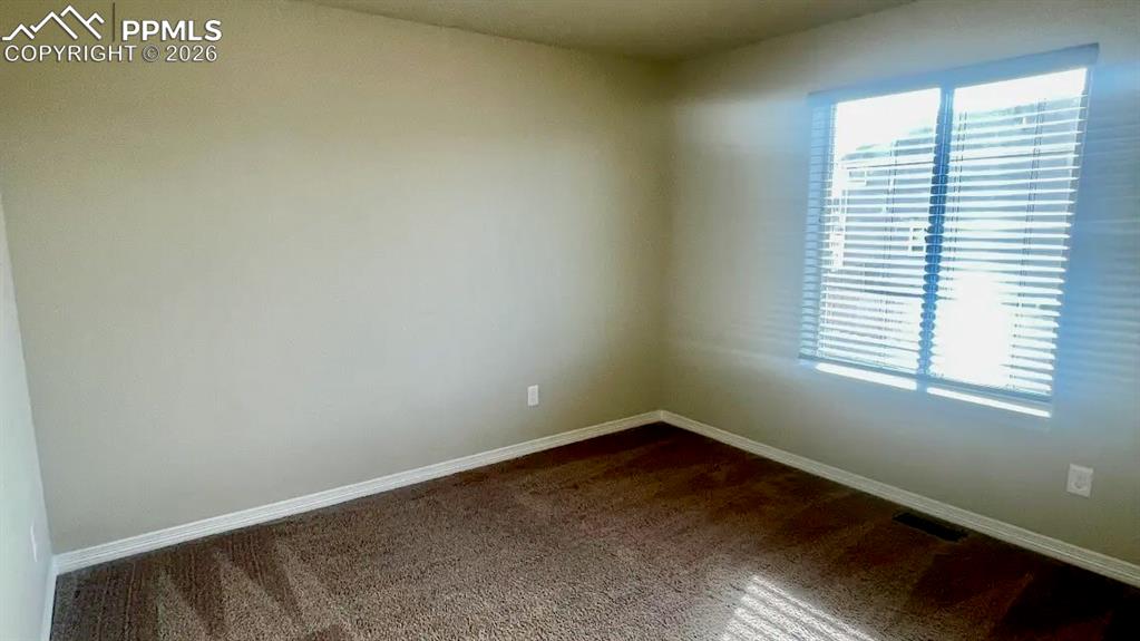 Image 13 of 15: Additional upper-level bedroom