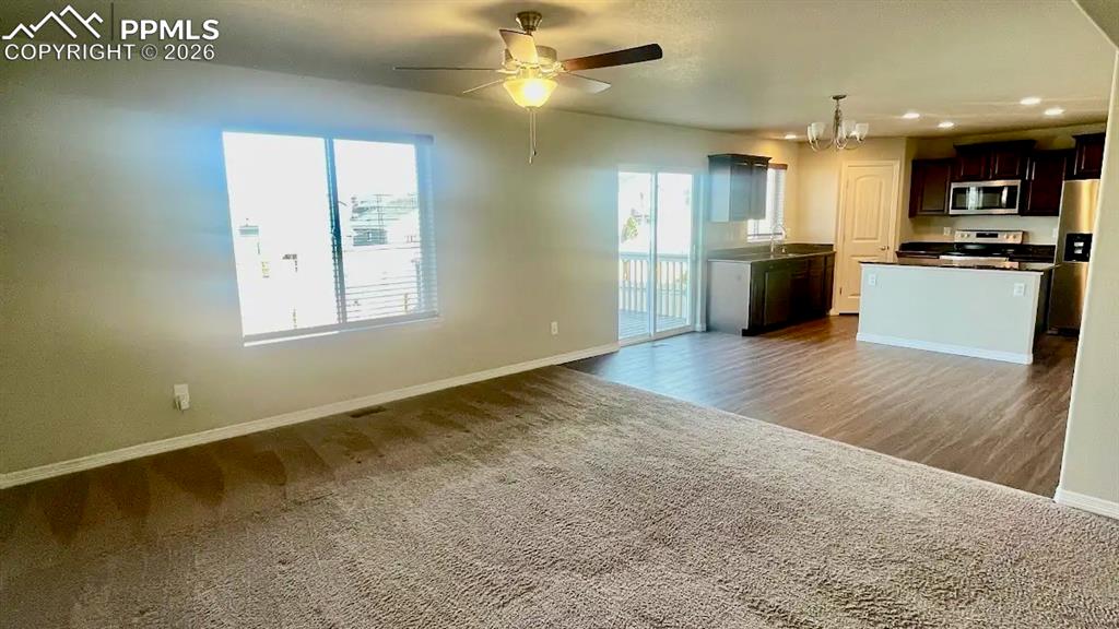 Image 3 of 15: Bright open-concept living area with seamless kitchen flow.