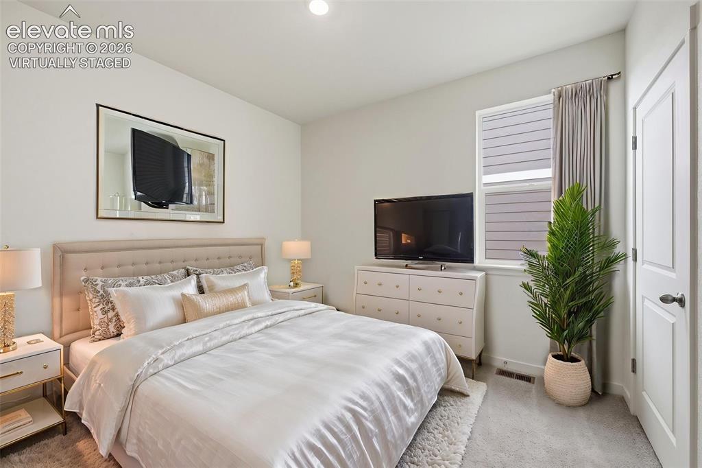 Image 13 of 23: Virtually Staged Photo. Spacious garage featuring a concrete floor, automat