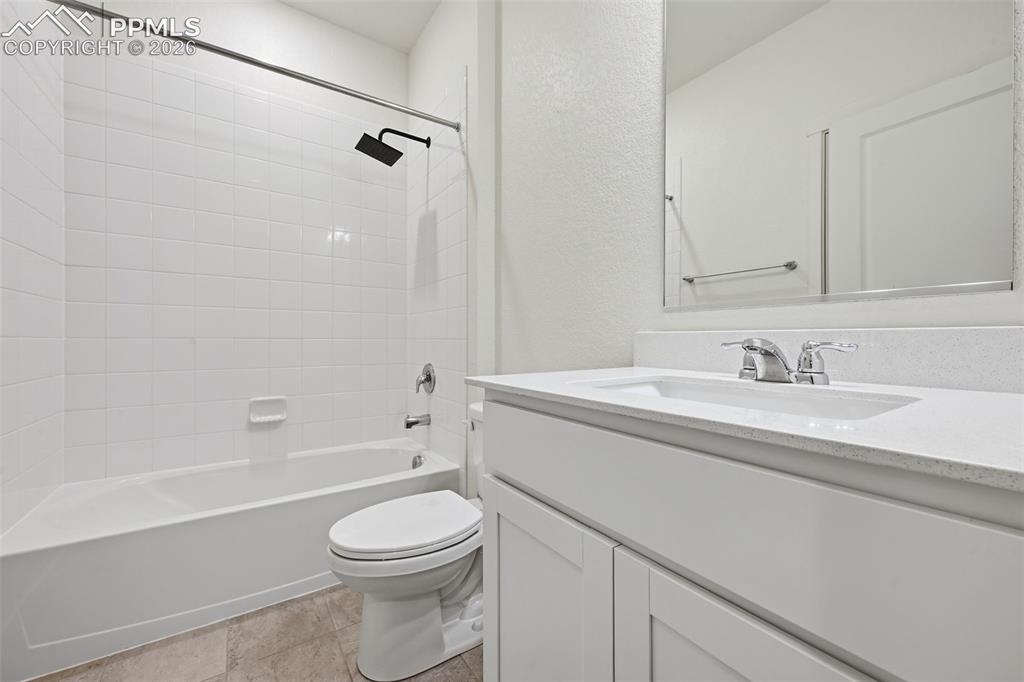 Image 15 of 23: Spacious room with light gray carpeting, neutral wall finishes, and a reces