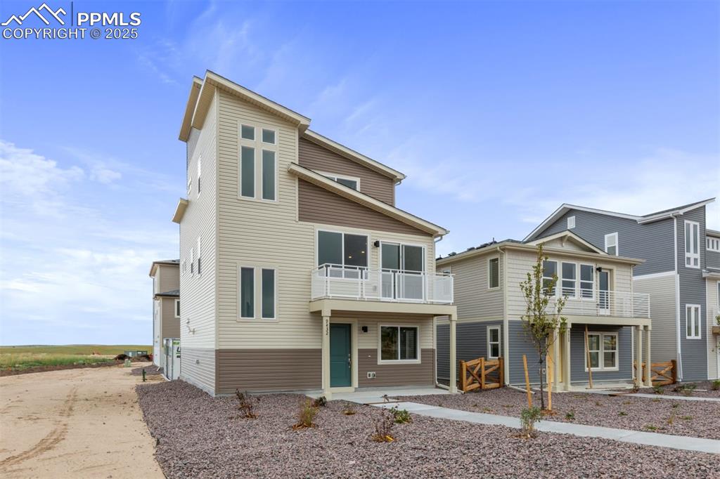 Image 4 of 6: Contemporary home featuring a balcony