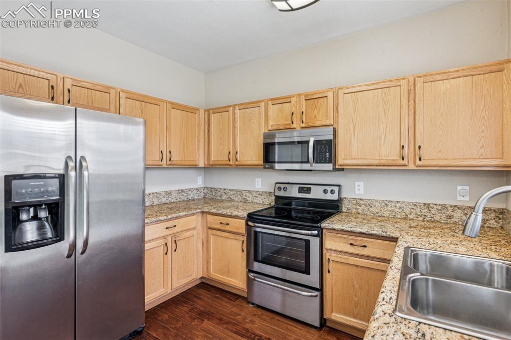 Image 11 of 39: Kitchen featuring stainless steel appliances, ample cabinetry, and plenty o