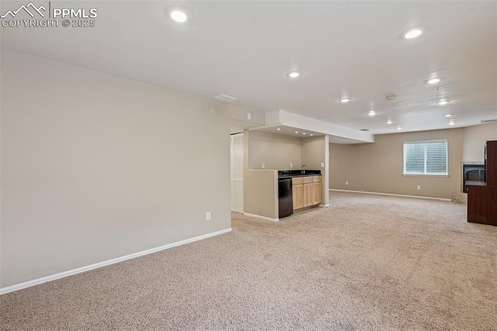 Image 27 of 39: Huge basement family room / rec bar / entertaining area