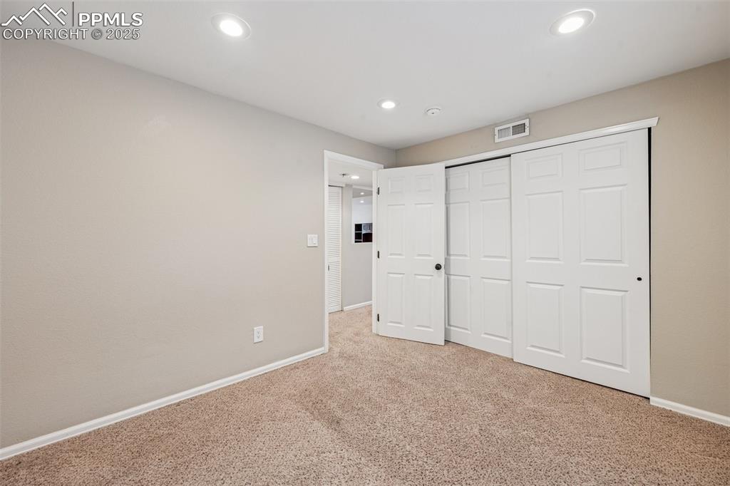 Image 29 of 39: Basement bedroom