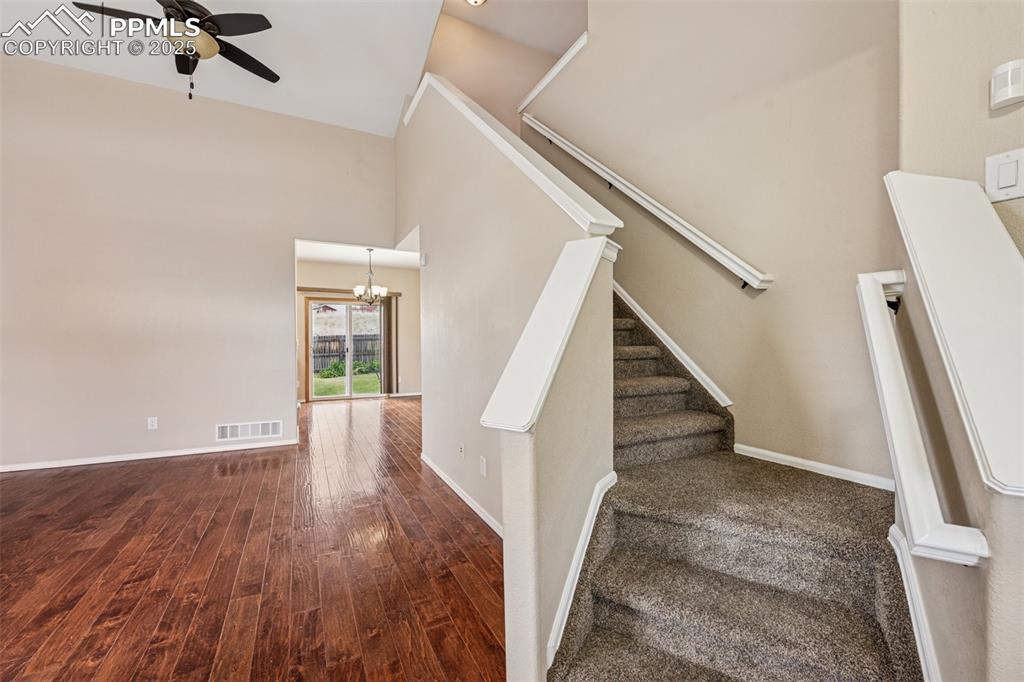 Image 4 of 39: Neutral color palette and warm wood flooring