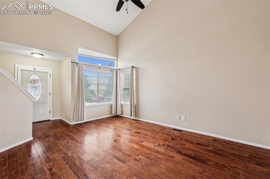 Image 7 of 39: Entrance foyer and bright, spacious Living Room