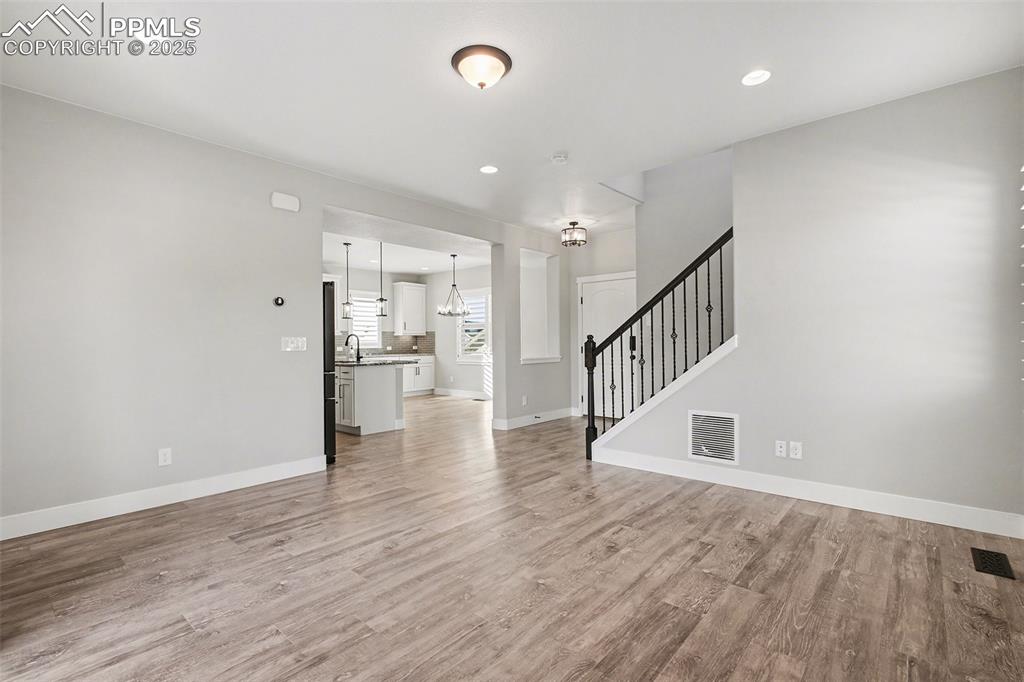 Image 9 of 20: Great living area with upgraded lighting