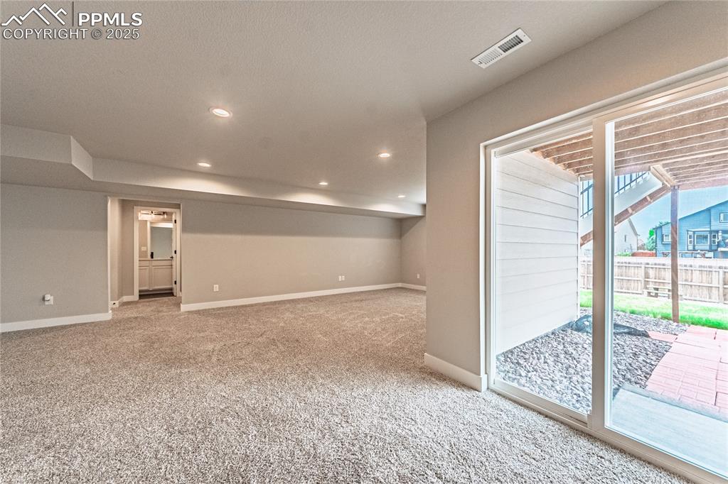 Image 26 of 39: Empty room featuring light carpet and recessed lighting