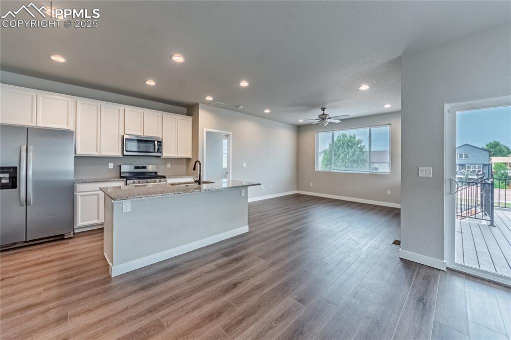 Image 5 of 39: Kitchen featuring appliances with stainless steel finishes, recessed lighti
