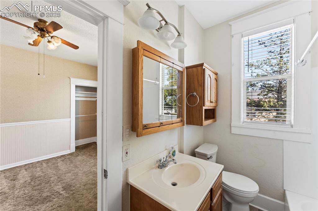 Image 9 of 27: Full bath with vanity and toilet