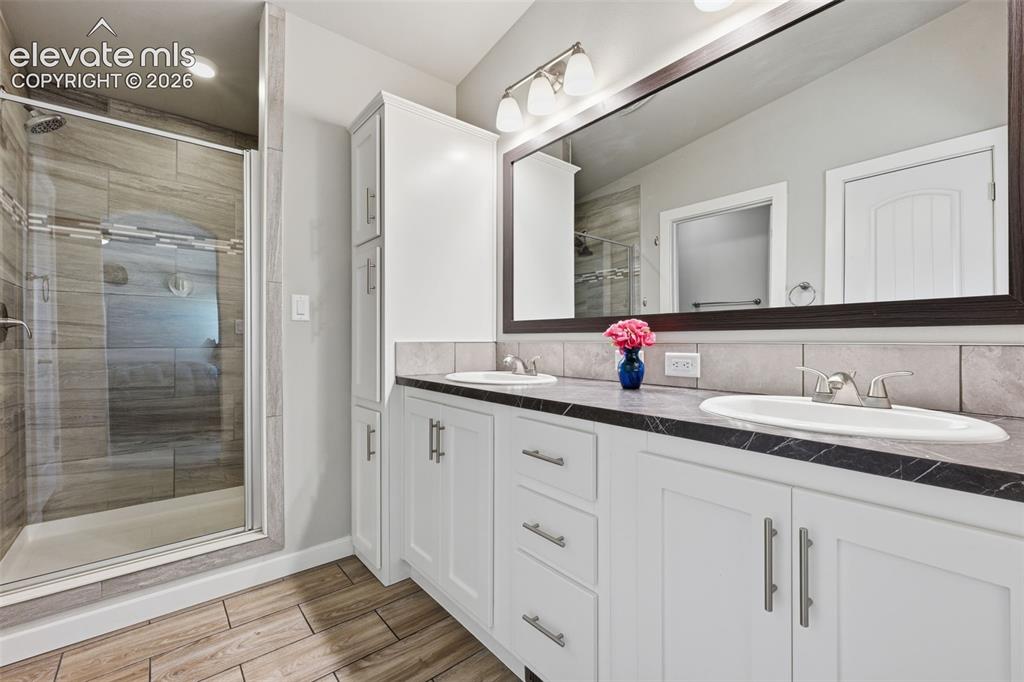 Image 13 of 27: Primary suite with peaceful prairie views and walk-in closet