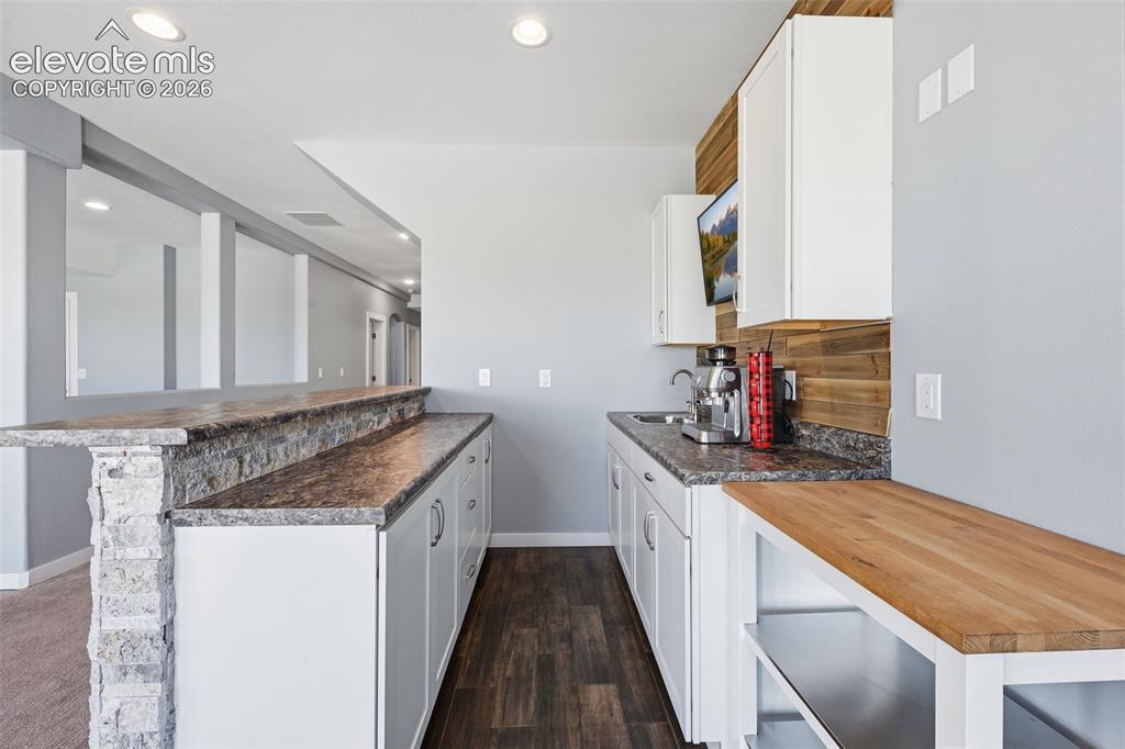 Image 18 of 27: Spacious walkout basement with flexible living possibilities