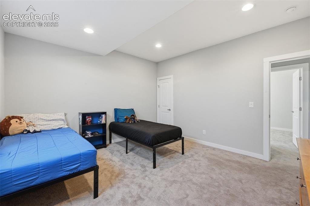 Image 20 of 27: Large walkout basement with recreation area and wet bar