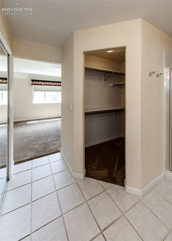 Image 31 of 39: Primary Bedroom Walk-in Closet
