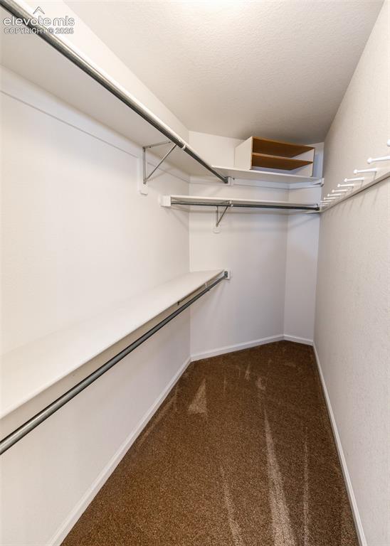 Image 32 of 39: Primary Bedroom Walk-in Closet