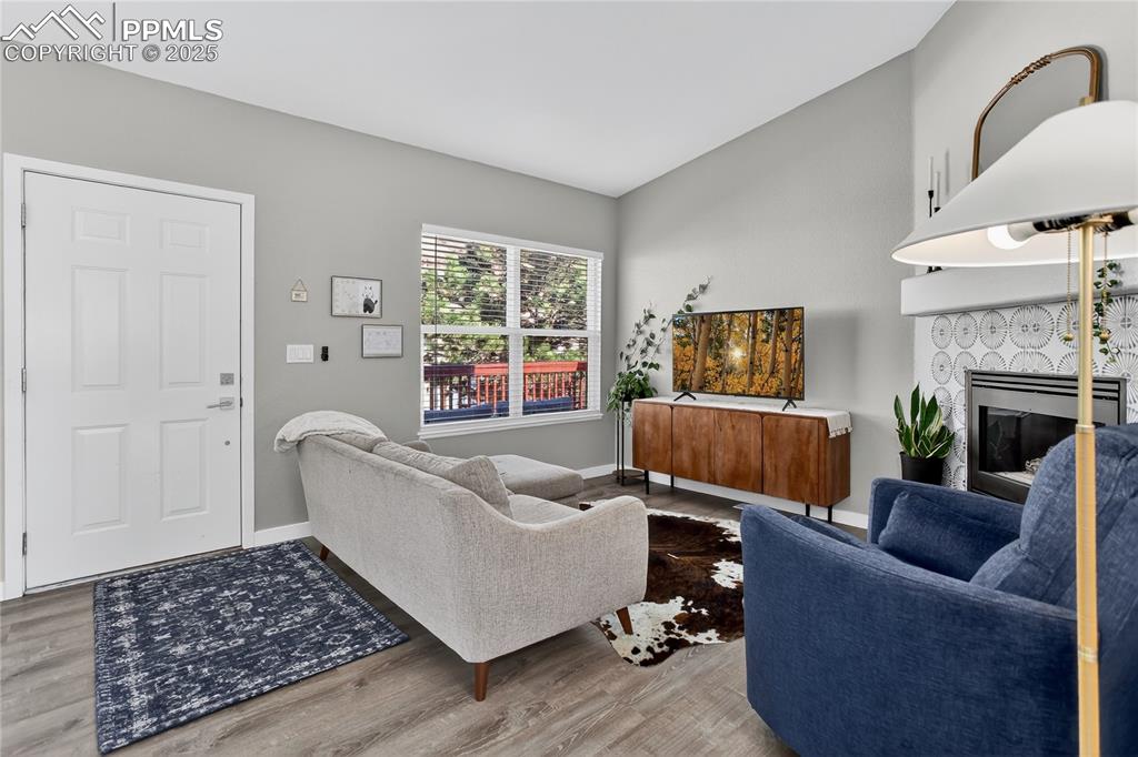 Image 2 of 14: Living room w/ vaulted ceiling