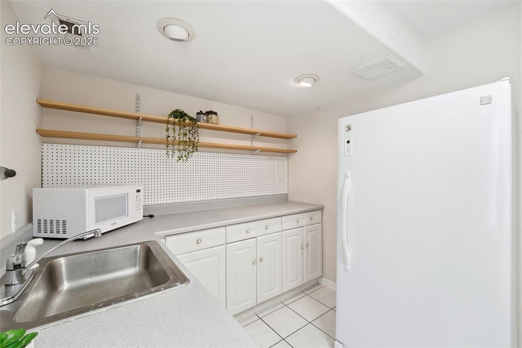 Image 31 of 47: Cabinetry and sink create an ideal setup for multi-generational living