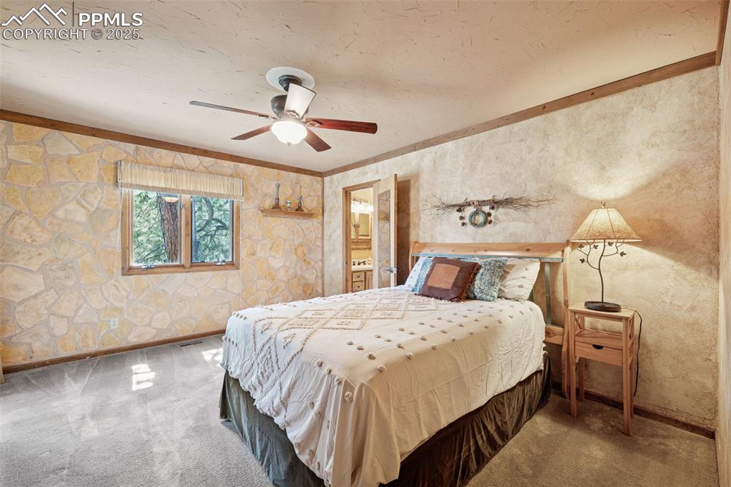 Image 21 of 47: 2nd Bedroom has own Pvt bath and a walkout to the back porch