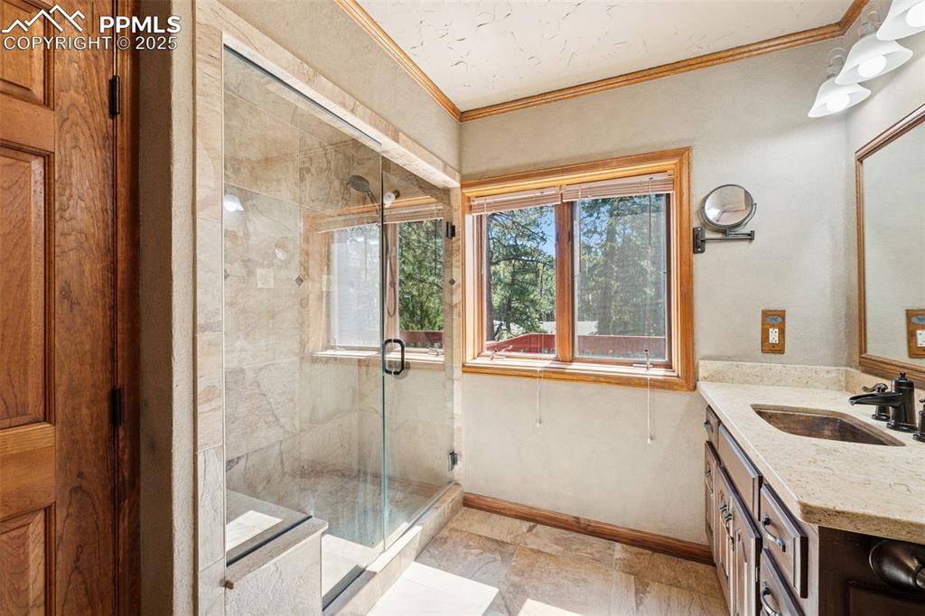 Image 27 of 47: Guest bath with beautiful shower