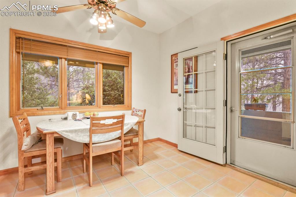 Image 15 of 48: Dining space featuring healthy amount of natural light, ceiling fan, and li