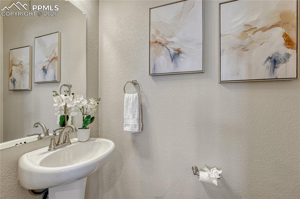 Image 14 of 29: Main level powder room.