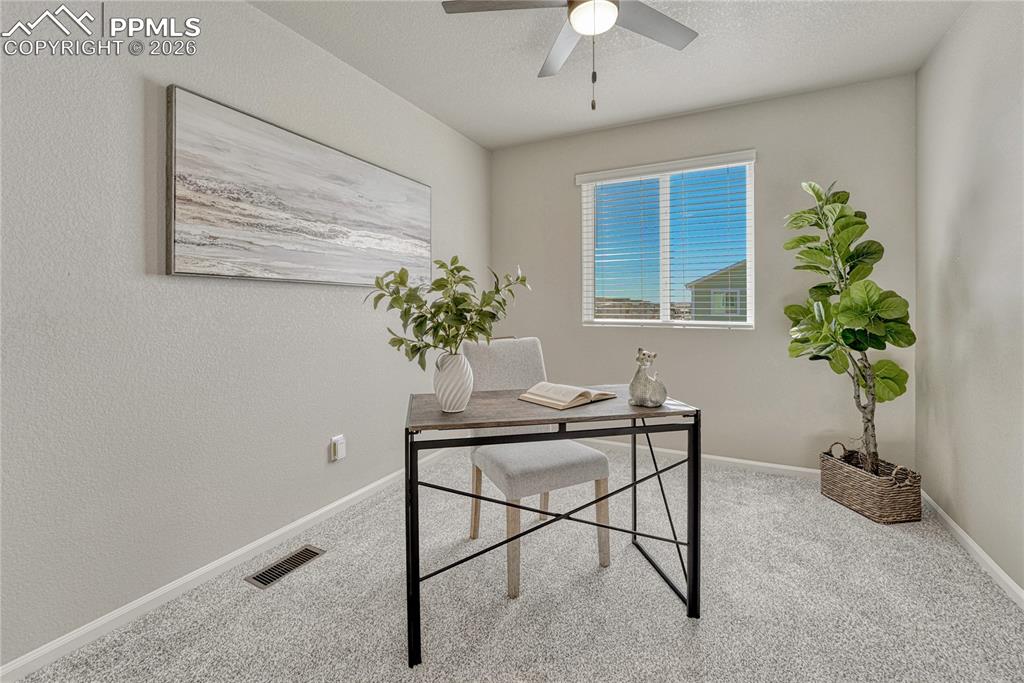Image 20 of 29: First of two additional upstairs bedrooms.