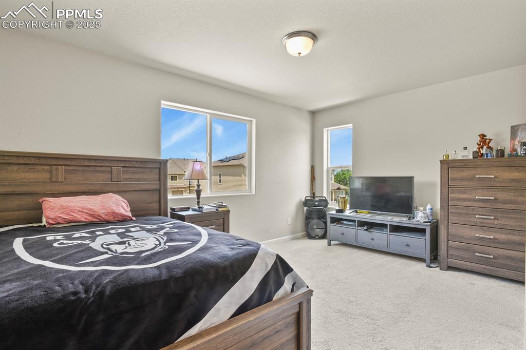 Image 15 of 27: Bedroom featuring carpet and baseboards