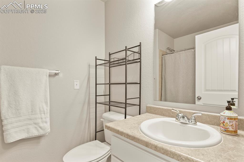 Image 16 of 27: Bathroom with vanity and a shower with curtain
