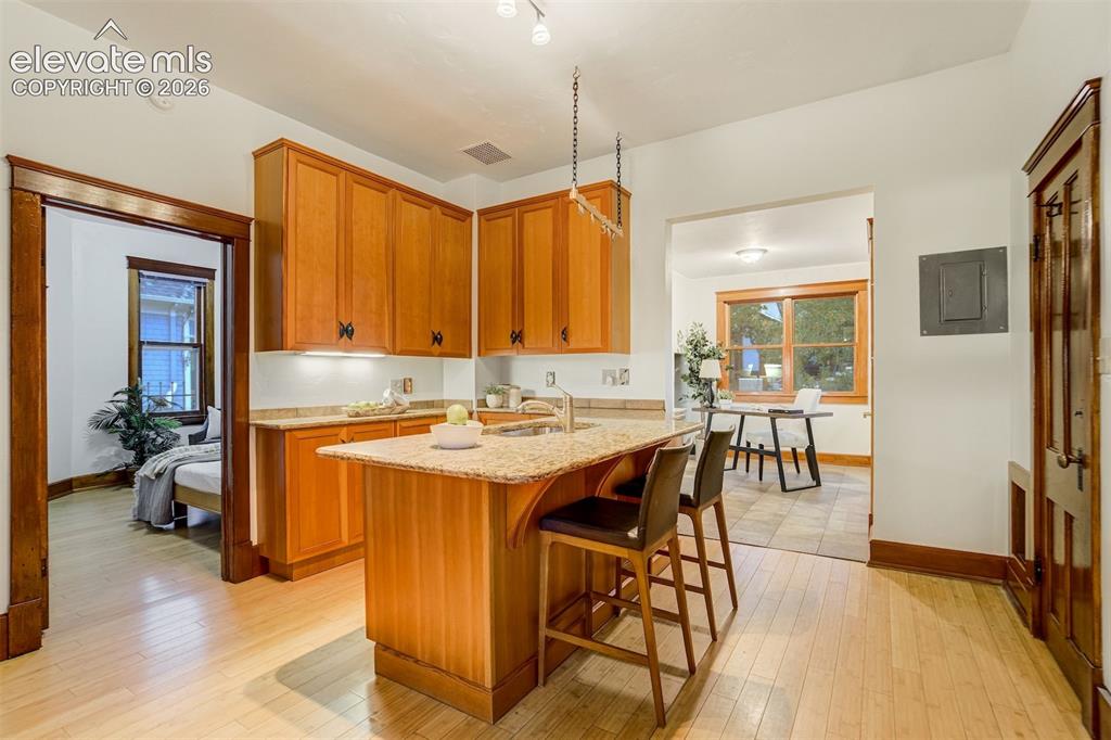 Image 10 of 40: Kitchen is very functional with island/bar space