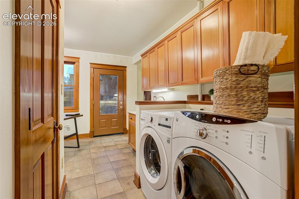Image 13 of 40: Amazing laundry space in this updated addition to the home