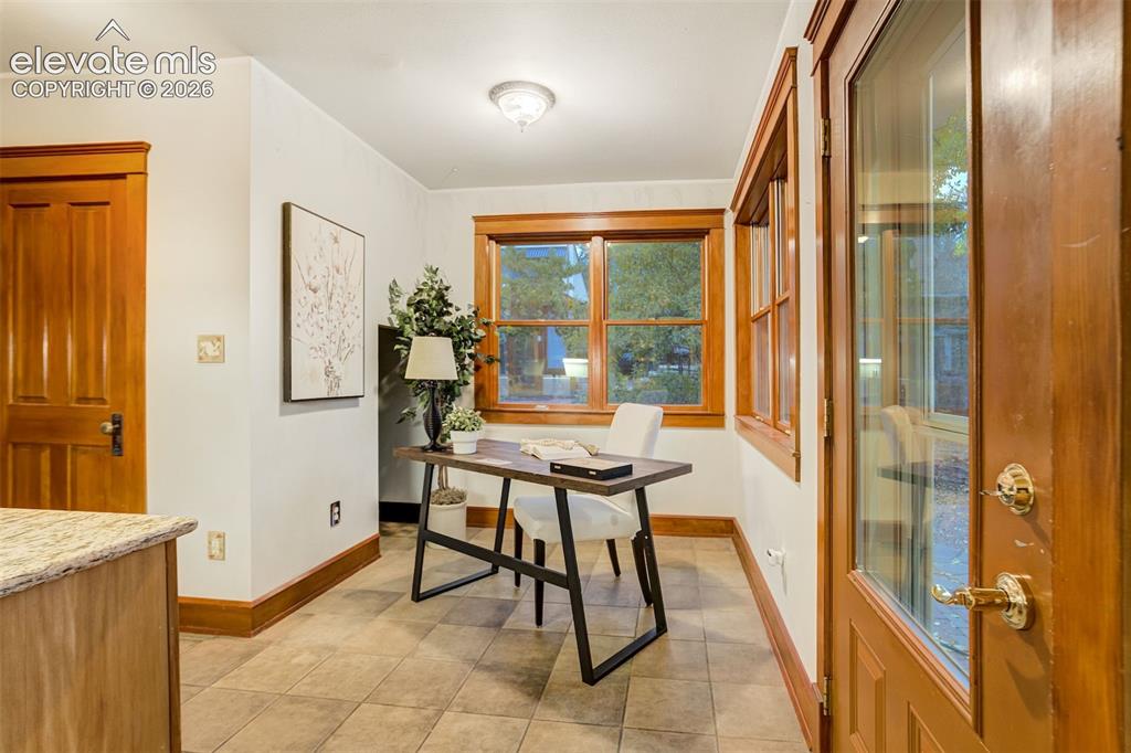 Image 15 of 40: This little space off the kitchen makes a great office nook