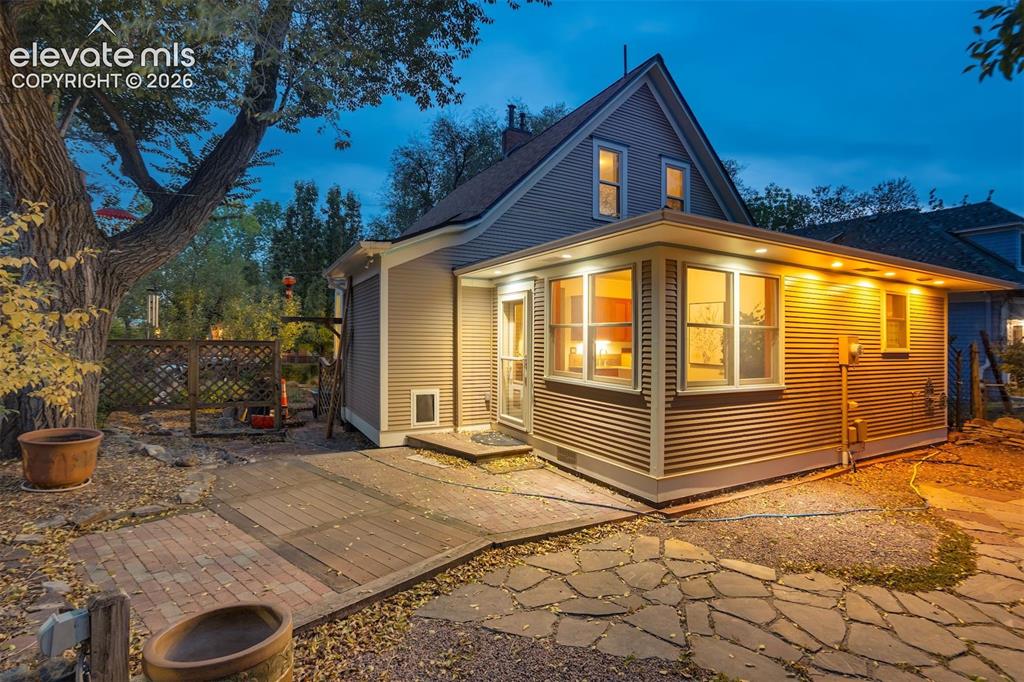 Image 30 of 40: Hardscaping featuring a mix of flagstone and brick pavers