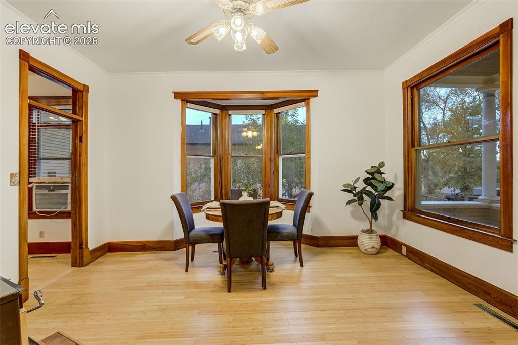 Image 5 of 40: Lots of natural light and such charming woodwork