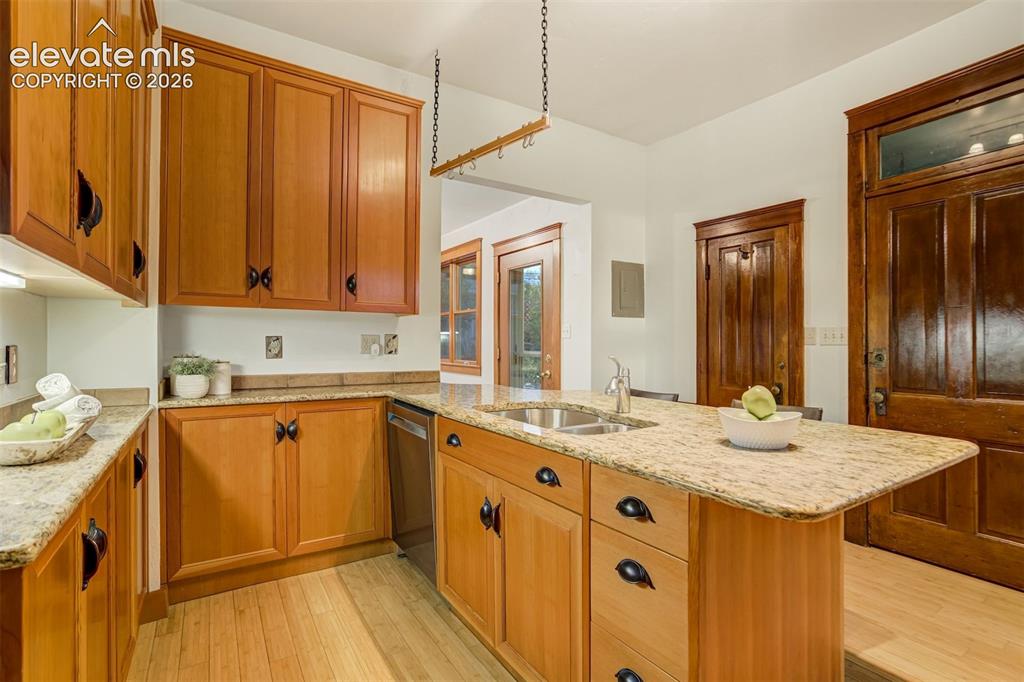 Image 9 of 40: Updated kitchen has lots of TALL cabinets for plenty of storage