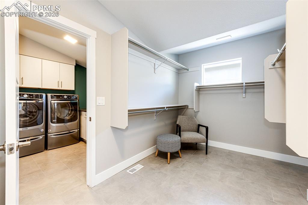 Image 21 of 46: Primary closet flows into the Laundry Area