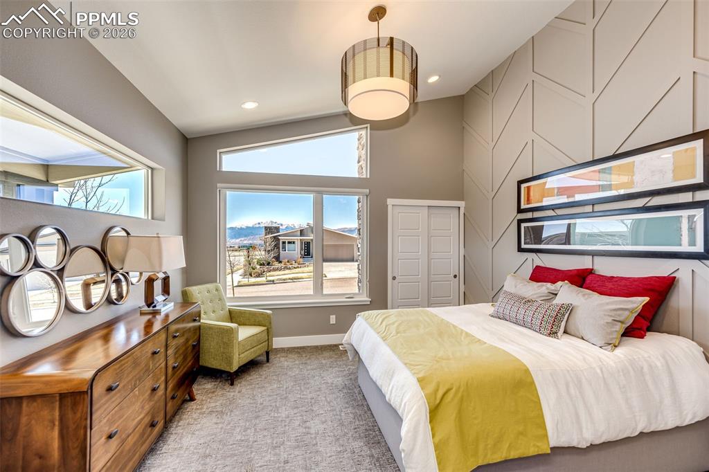 Image 4 of 46: Impress your visitors! Give them the front bedroom with Pikes Peak view!