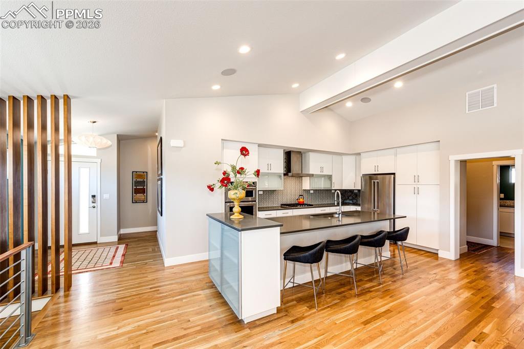 Image 9 of 46: Front entry on left and garage entry on the right add to flow inside