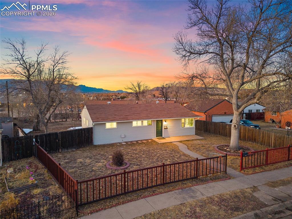 Image 23 of 29: Single story home featuring a patio, a fenced backyard, and a mountain view