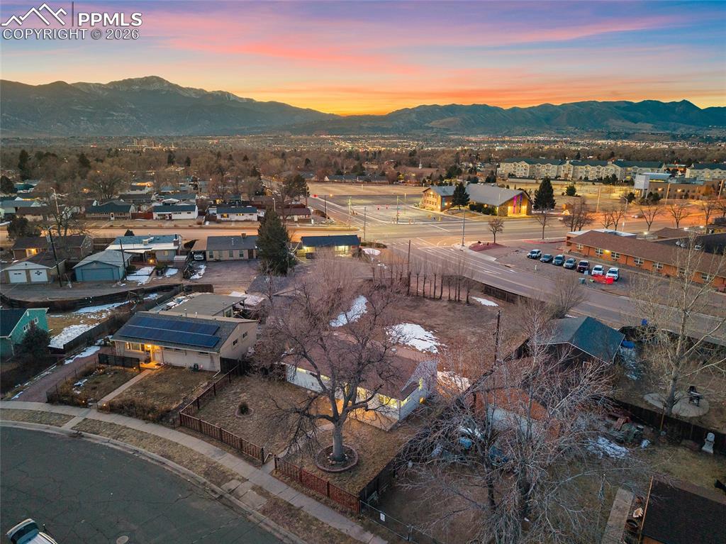 Image 27 of 29: Aerial view at dusk of a mountain view and a residential view