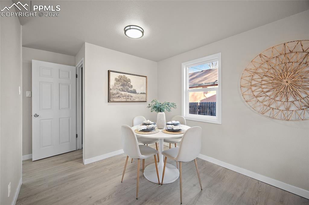 Image 6 of 29: Dining space featuring baseboards and light wood-style flooring