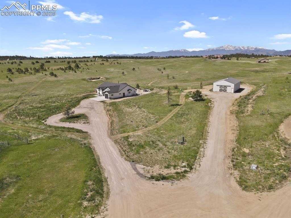 Caption: Birds eye view of property featuring a mountain view and a rural view