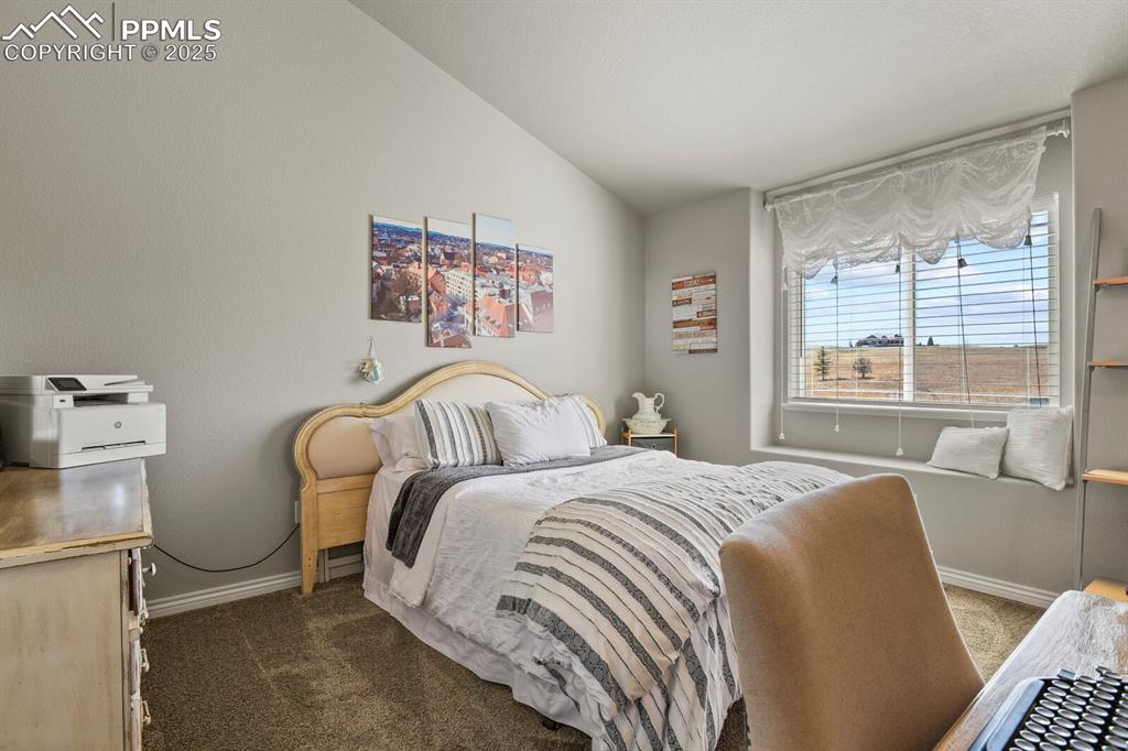 Image 21 of 49: Mainfloor bedroom with attached bath and private sink